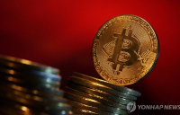 비트코인, 사상 첫 7만달러 웃돌아…신고점 경신 후 하락 조정